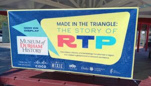 Exhibit banner with title and major sponsors